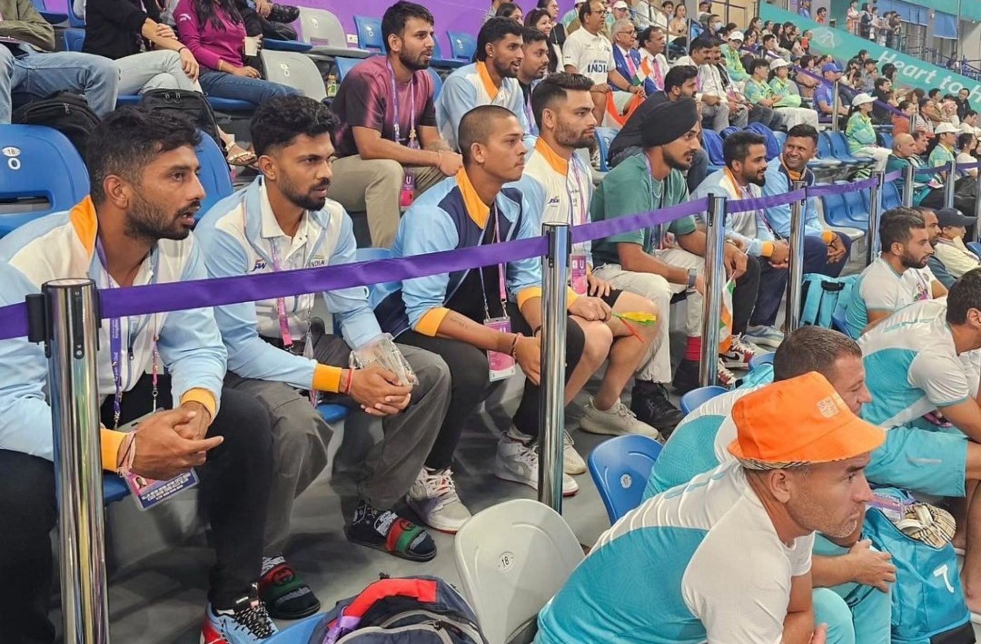 Indian cricketers watching hockey match at the Asian Games. 