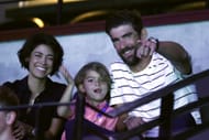 Michael Phelps along with wife Nicole Johnson watch the men's 400m Individual Medley at the 2021 U.S. Olympic Trials in Omaha, Nebraska