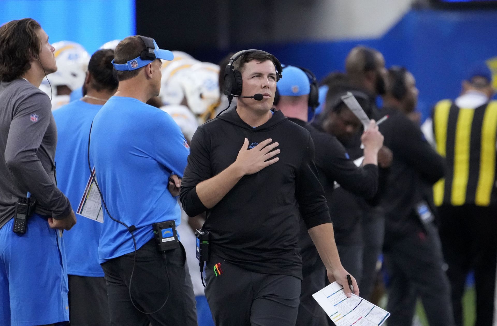 Offensive coordinator Kellen Moore of the Los Angeles Chargers looks on from the sideline during the first half of a preseason NFL game against the Los Angeles Rams at SoFi Stadium on August 12, 2023, in Inglewood, California.