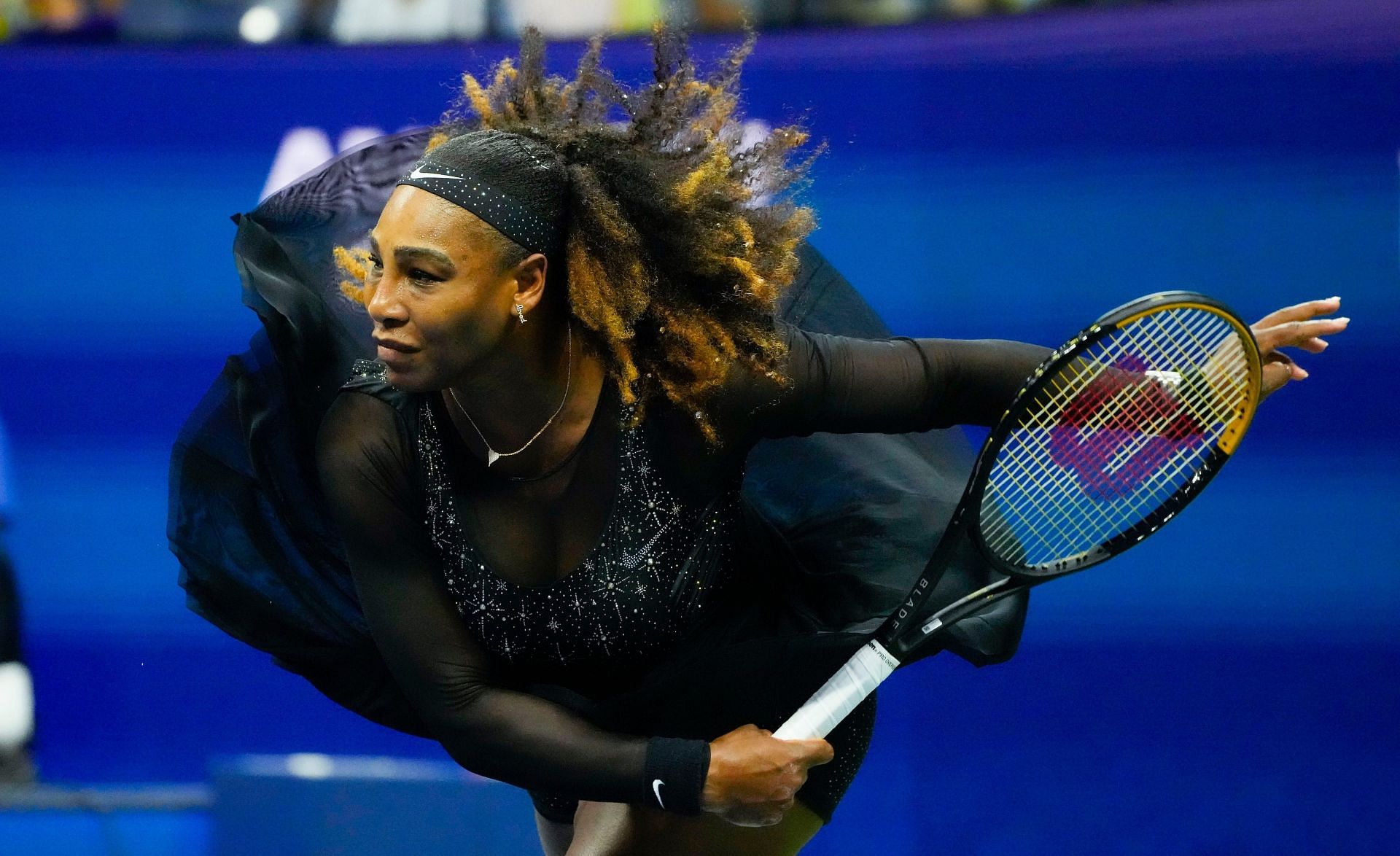 Serena Williams hits a serve during her first-round match at the 2022 US Open