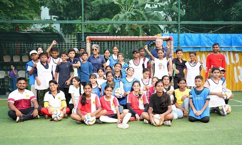 El Moutawakel and PT Usha with the children at the Magic Bus Project