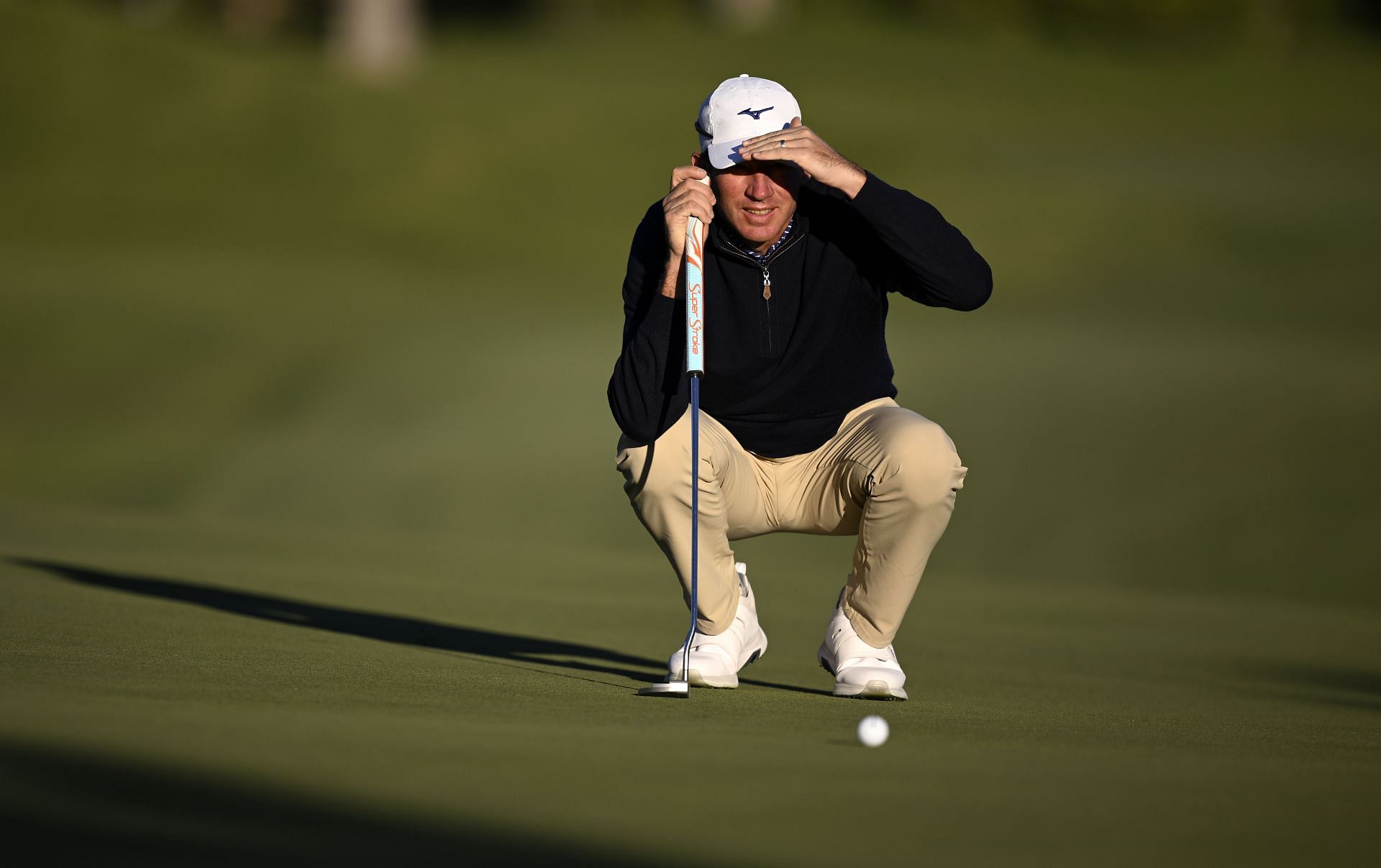 Jim Herman of the United States lines up a putt on the first green during the first round of the Shriners Children&#039;s Open (Image via Getty)