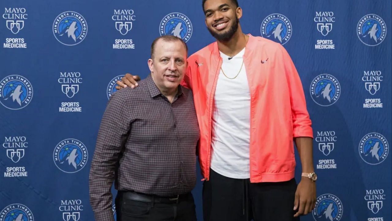Tom Thibodeau (L) posing with Karl-Anthony Towns