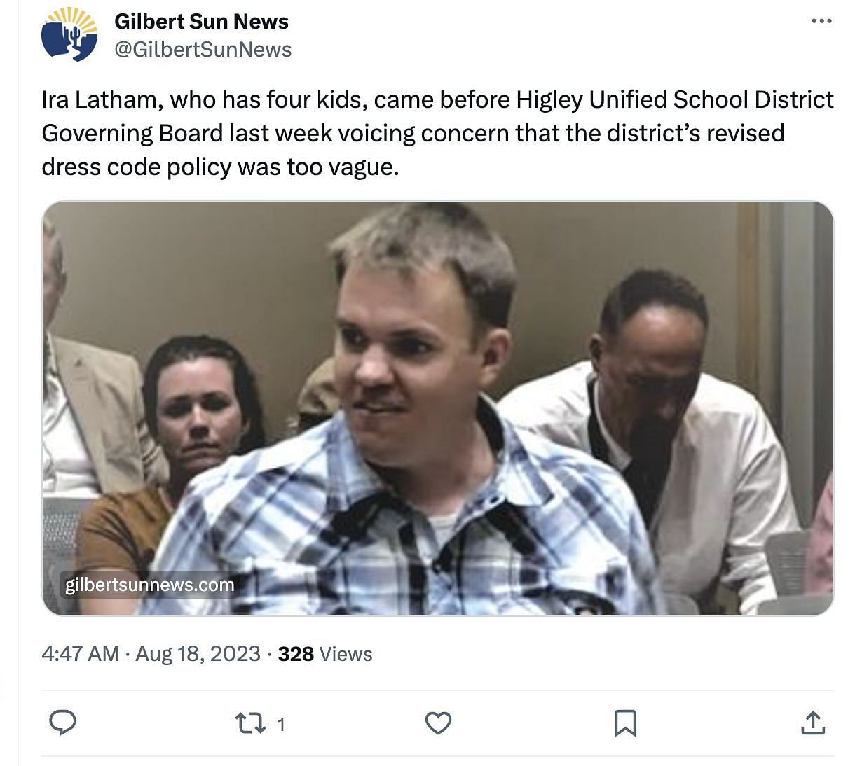 Latham, father of four, strips down at a school board meeting to protest about the new dress code policy. (Image via Twitter)