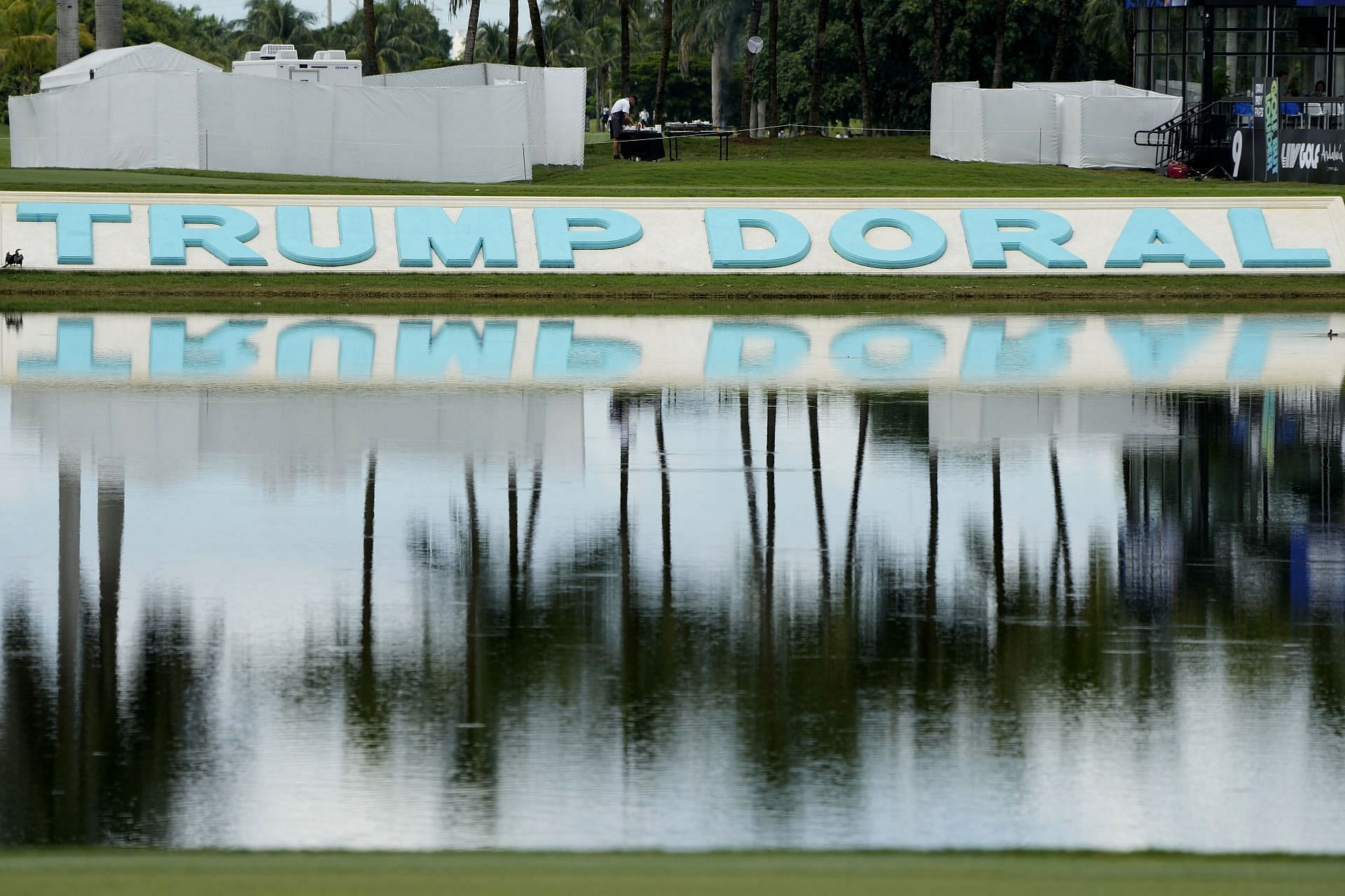 A Trump Doral sign is reflected in the water at the LIV Golf Team Championship at the Trump National Doral golf club, Friday, Oct. 20, 2023 (AP Photo/Lynne Sladky)