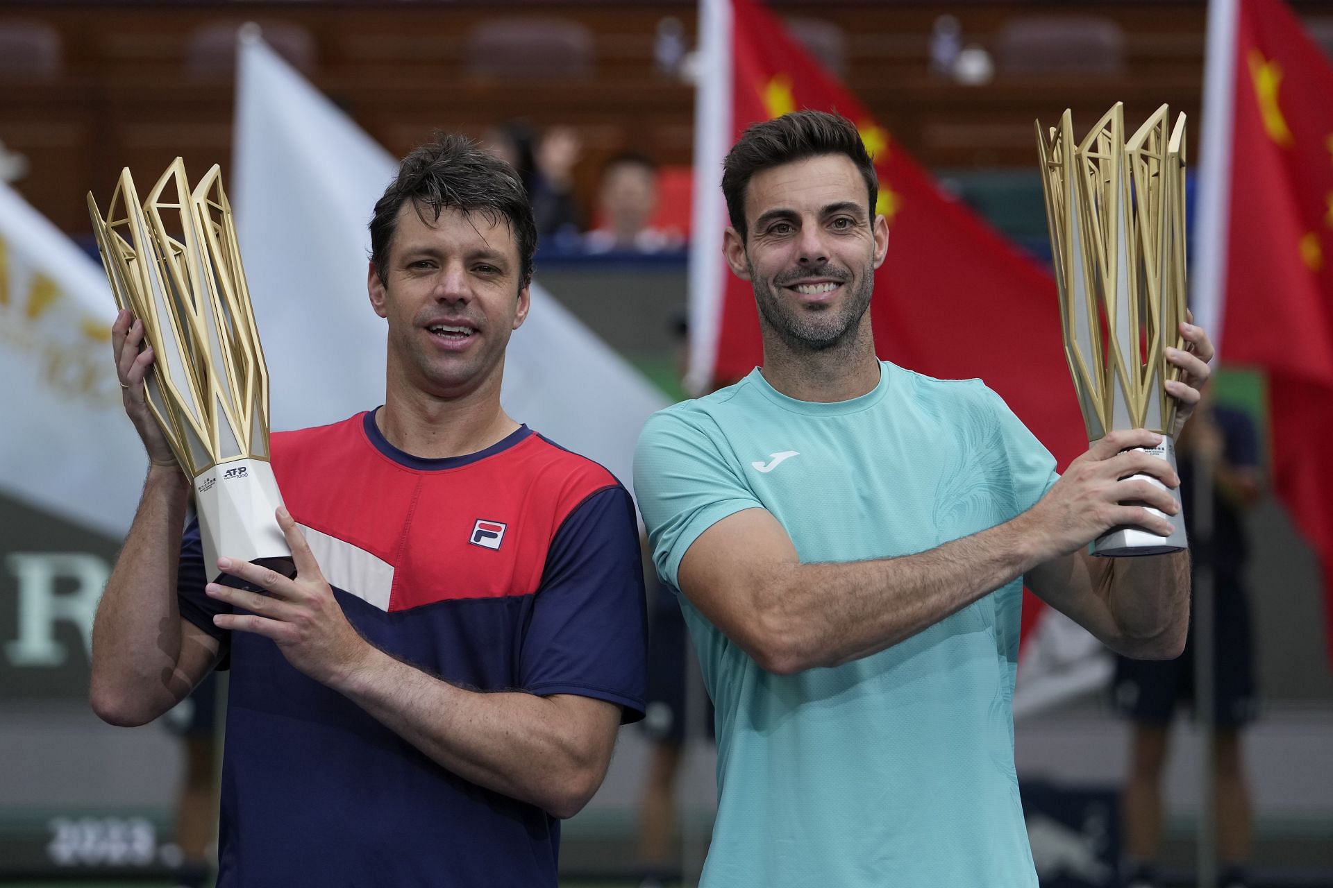 Horacio Zeballos and Marcel Granollers with the men&#039;s doubles winners&#039; trophies in Shanghai