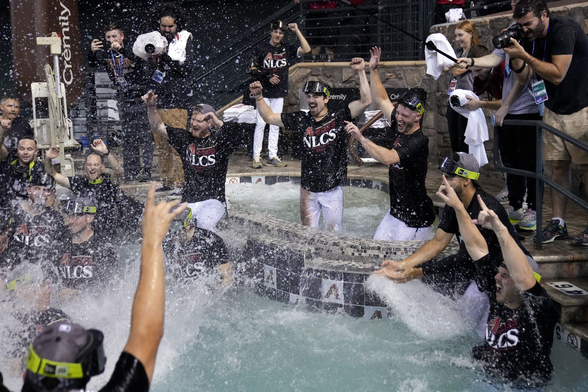 Members of the Arizona Diamondbacks celebrate in the pool after defeating the Los Angeles Dodgers