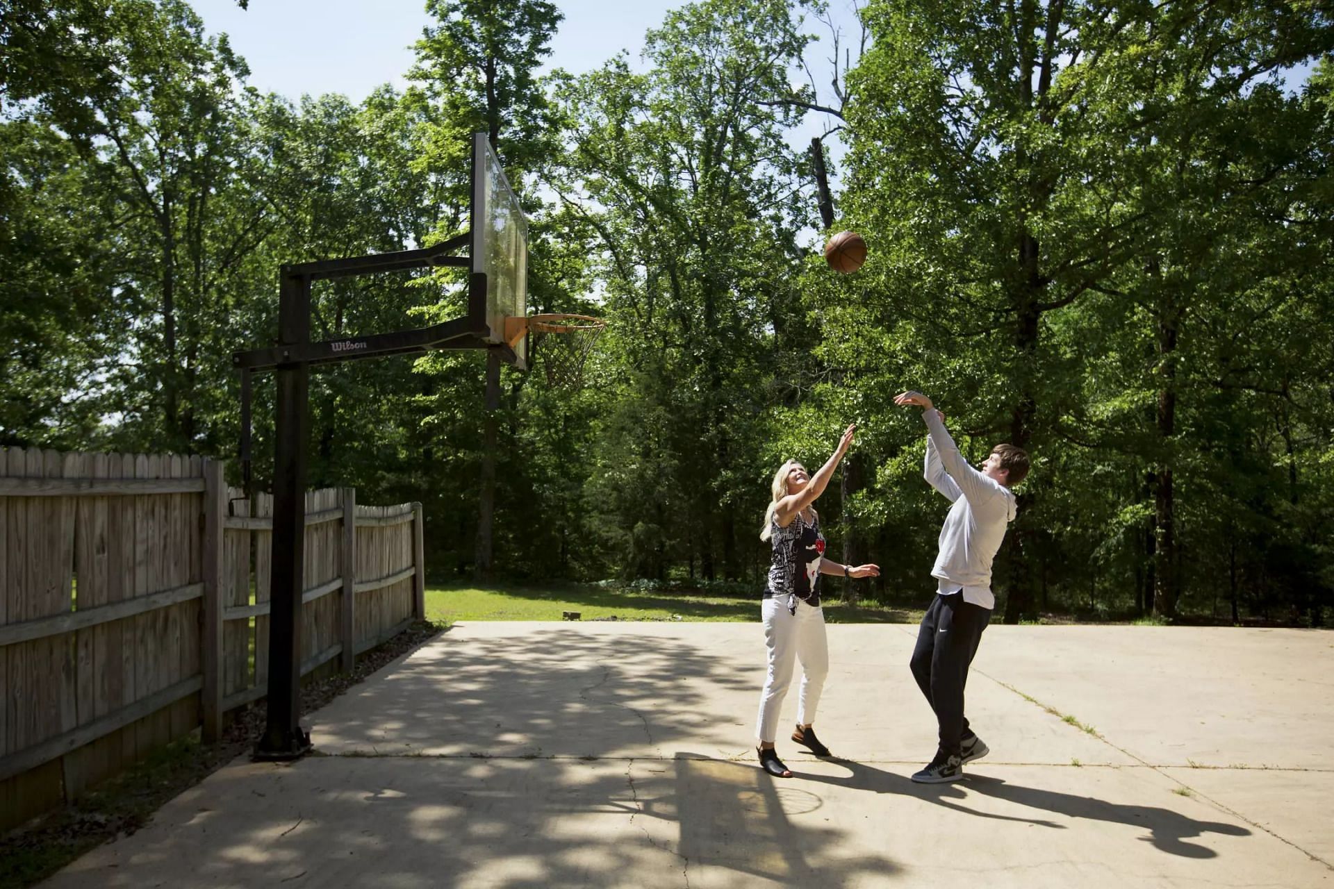 Reaves and his mother, Nicole Wilkett, playing basketball in their 300-acre farm (Photo credit: Steven Jones / For The Times)