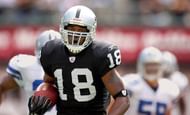 Oakland Raiders receiver Randy Moss sprints upfield on a 79-yard pass reception in the first quater of19-13 victory over the Dallas Cowboys at McAfee...