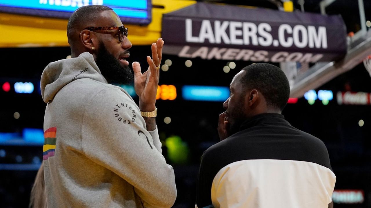 LeBron James talking to his agent and Klutch Sports Group founder Rich Paul