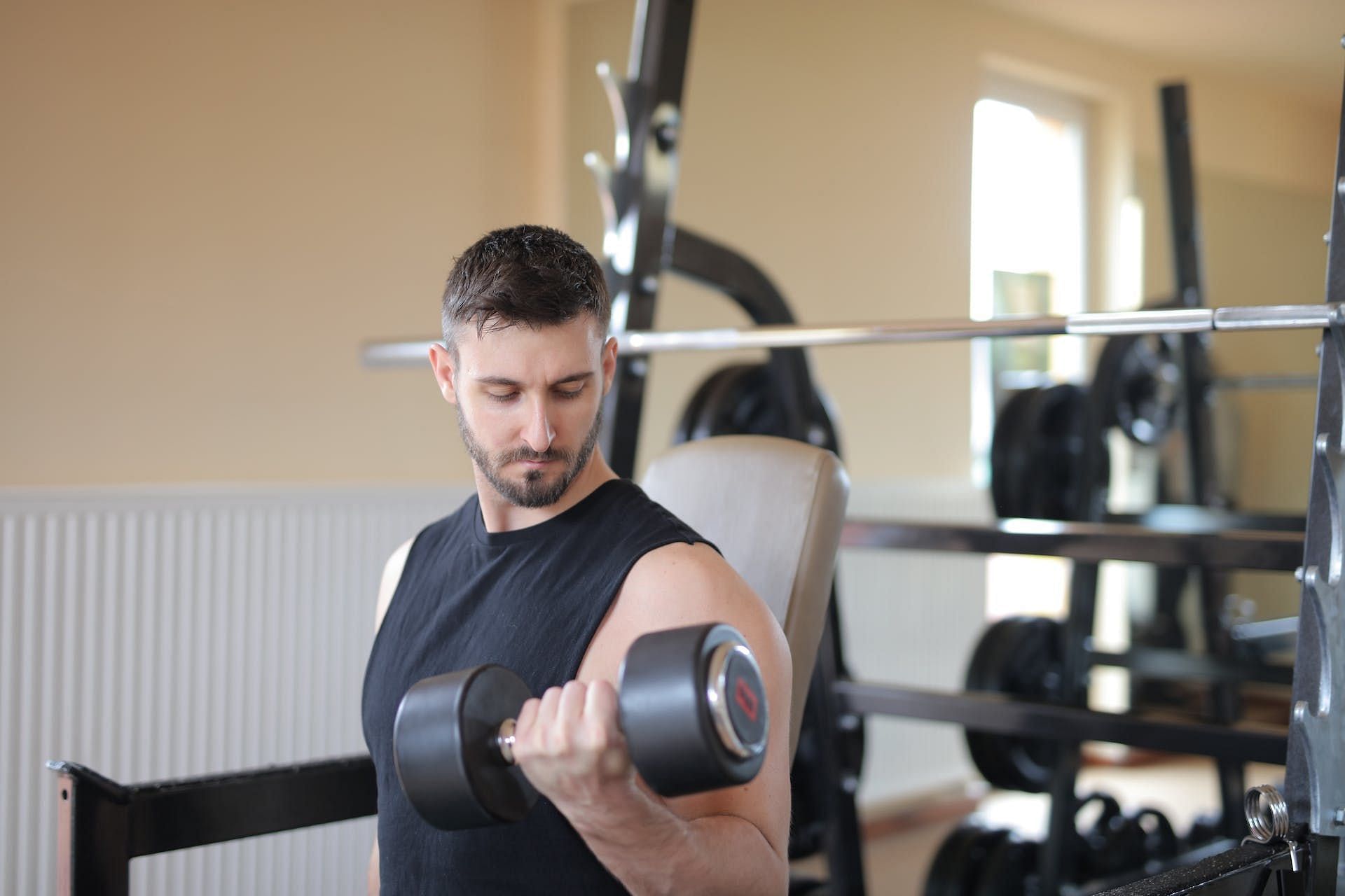 Dumbbell curls. (Image credits: Pexels/ Andrea Piacquadio)