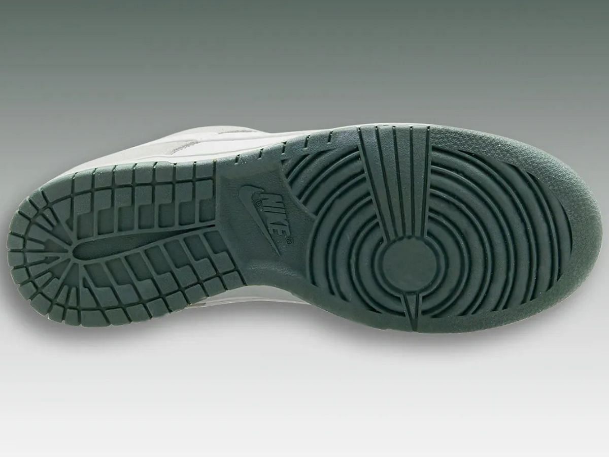 Sole of Nike Dunk Low Photon Dust Vintage Green sneakers (Image via Sneaker News)