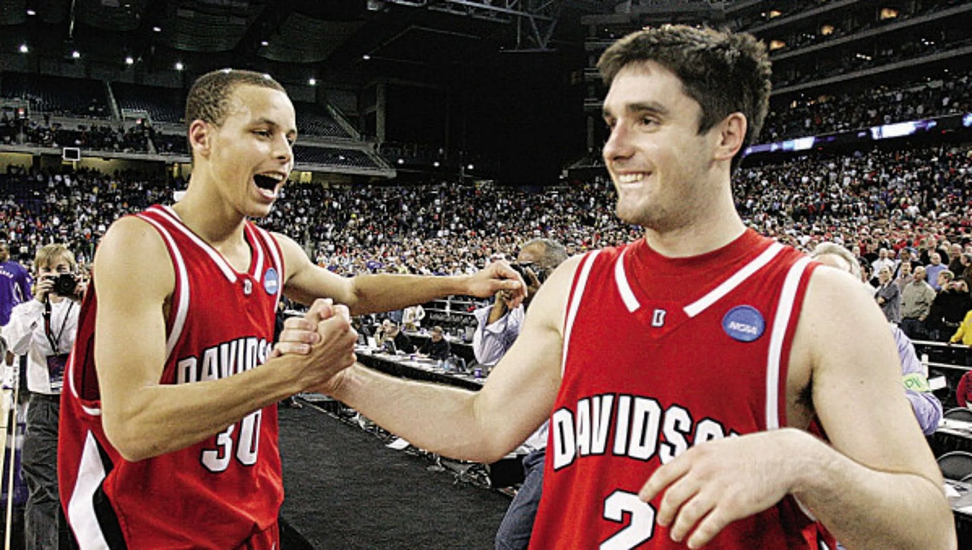 Davidson&rsquo;s Stephen Curry celebrates with teammate Jason Richards after beating Wisconsin by 17 to reach the Elite Eight (AP Photo/Michael Conroy) 