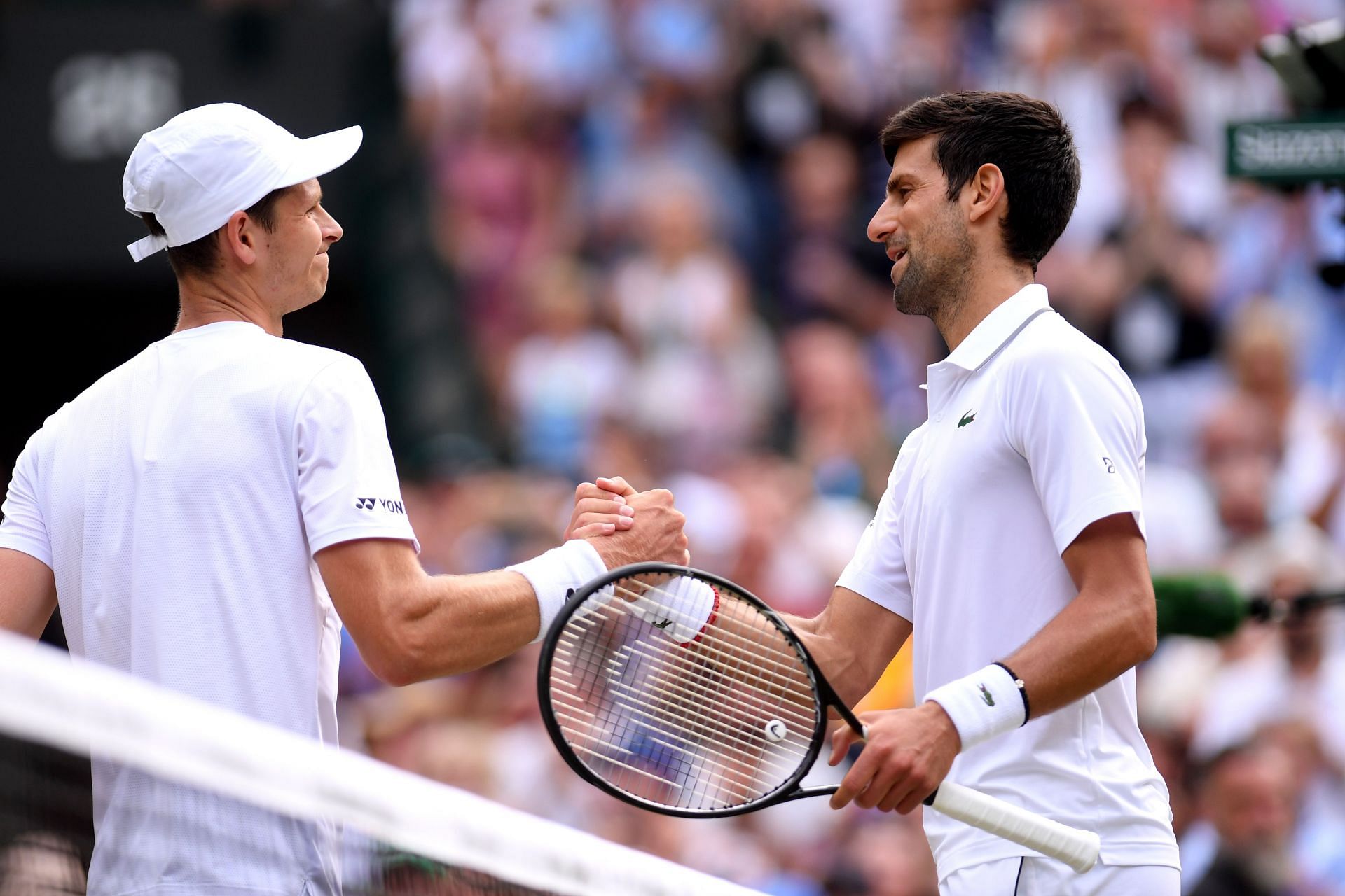 Hubert Hurkacz and Novak Djokovc at the 2019 Wimbledon Championships