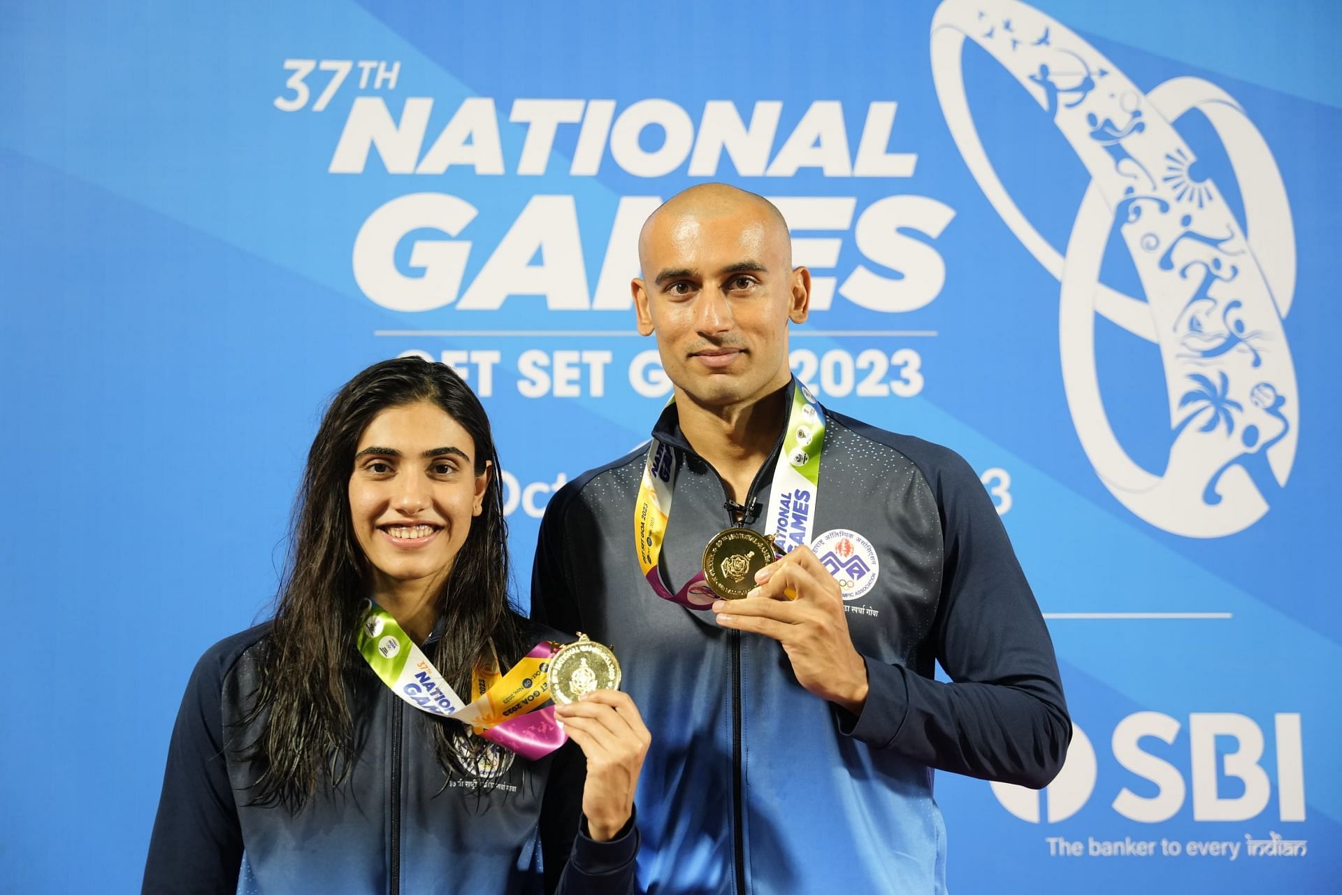 Virdhawal Khade with his wife and gold medalist at 37th National Games, Rujuta Khade