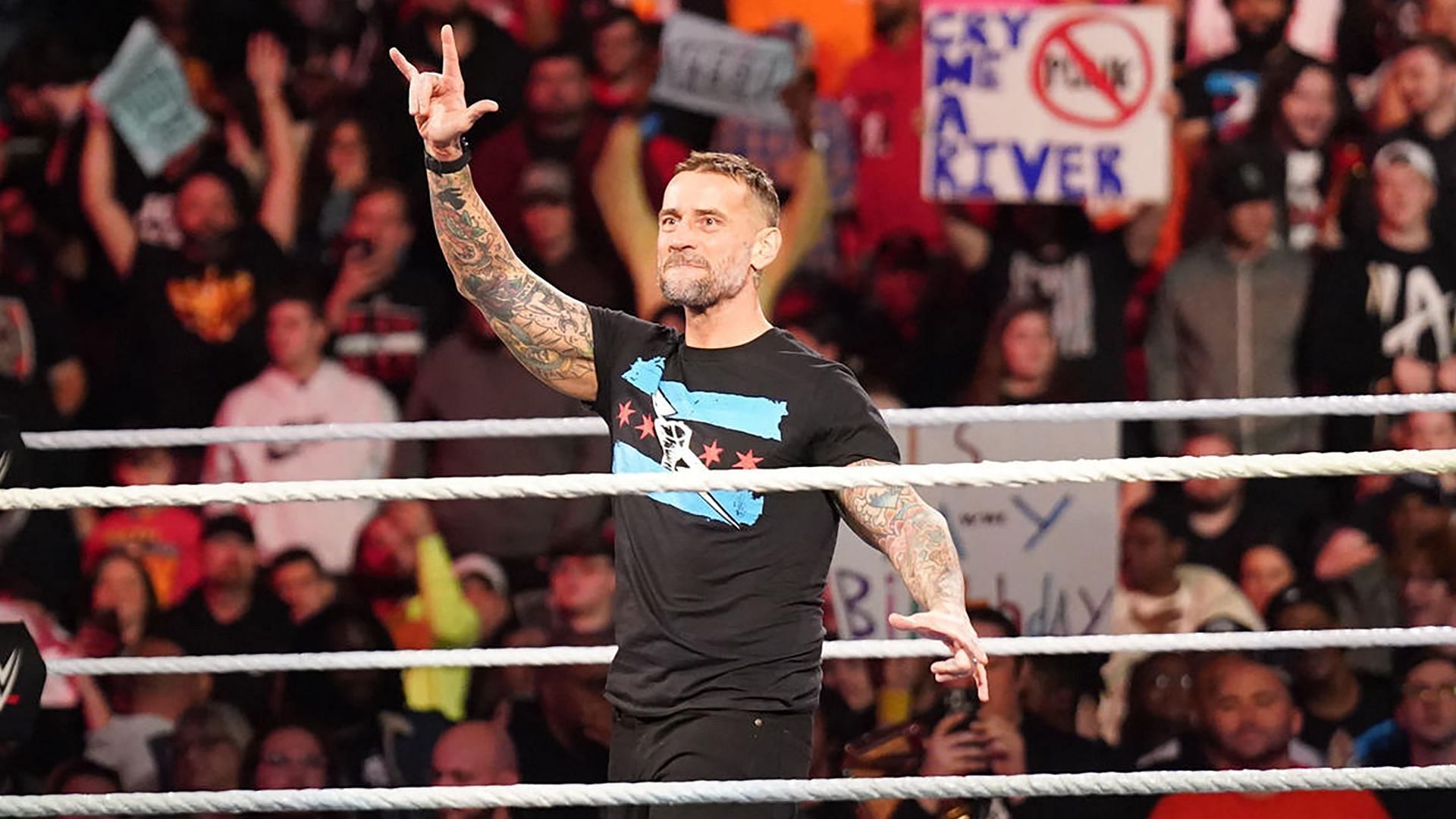 CM Punk speaks to the crowd during WWE RAW return