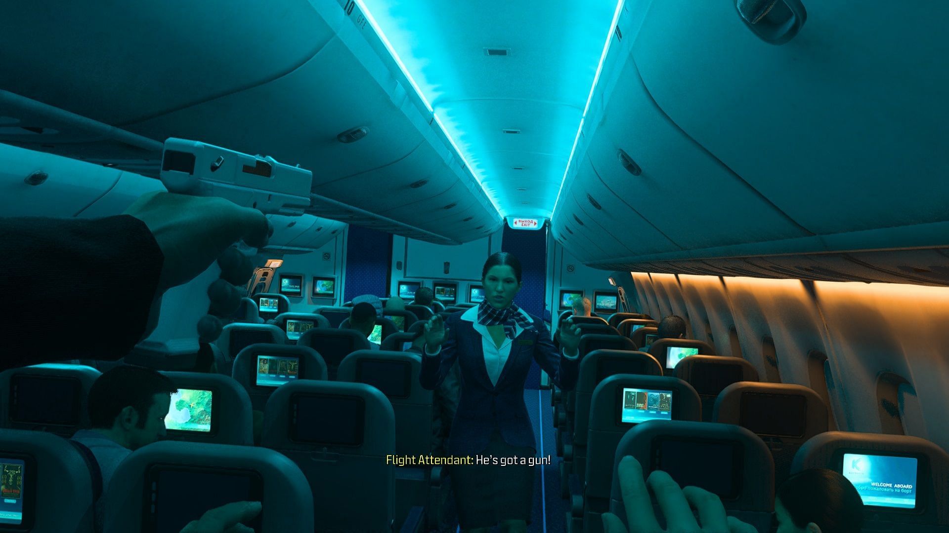 A hijacker pointing his gun at a flight attendant