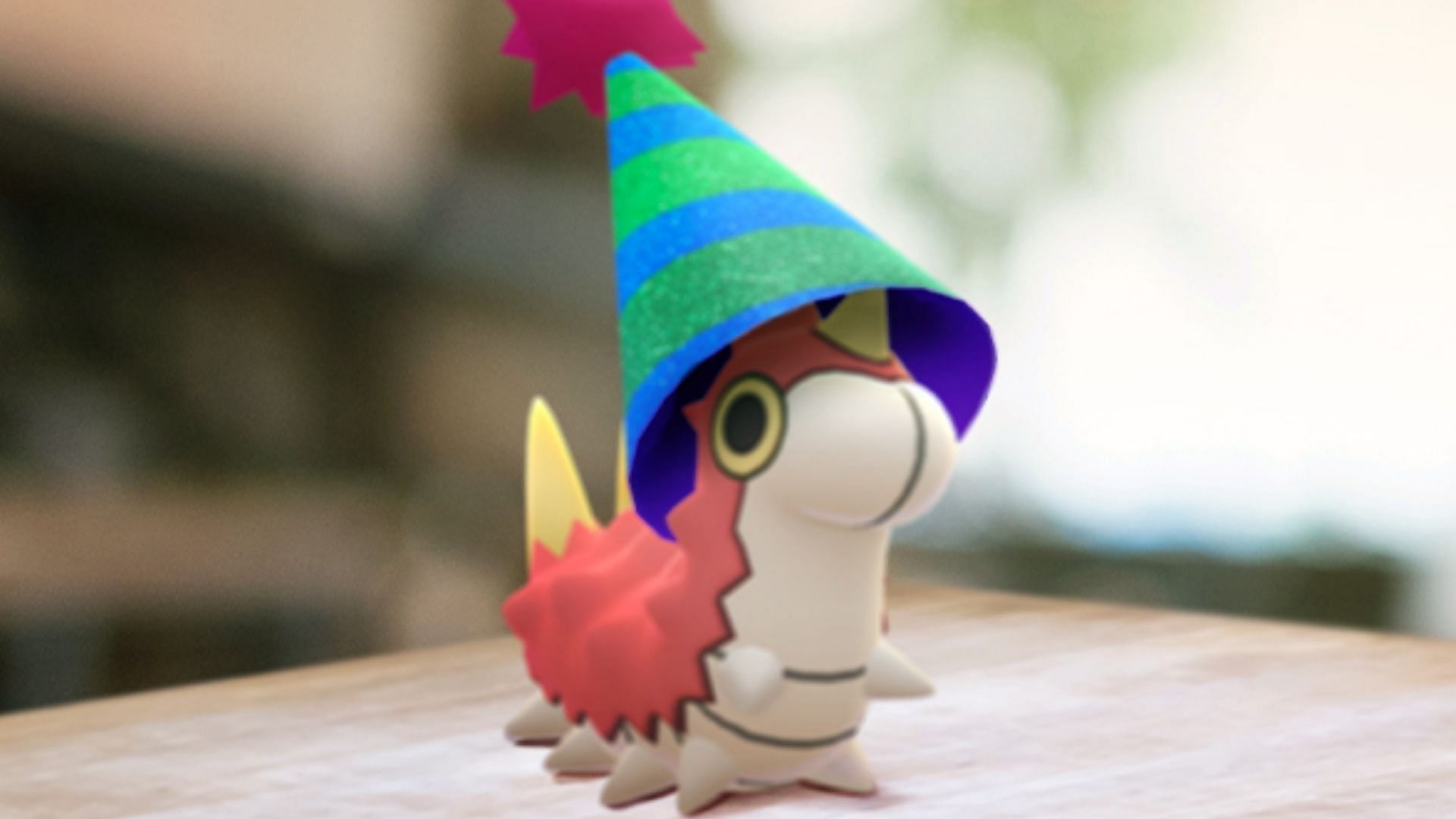 Official AR photo of Party Hat Wurmple (Image via Niantic)