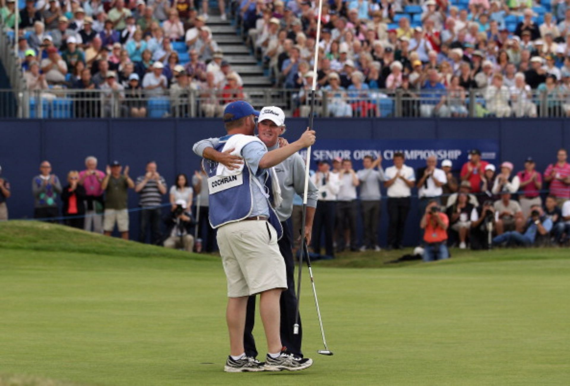 Reed Cochran caddying for his father in 2011 (Image via Getty).