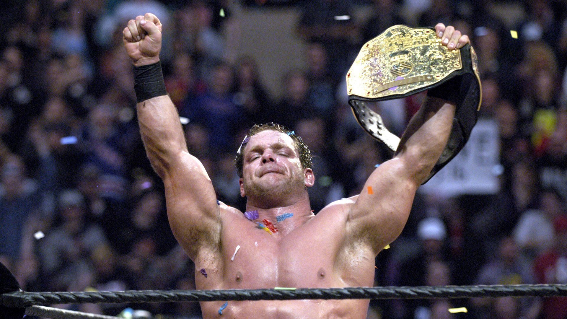 Chris Benoit celebrates with the WWE World Heavyweight Title