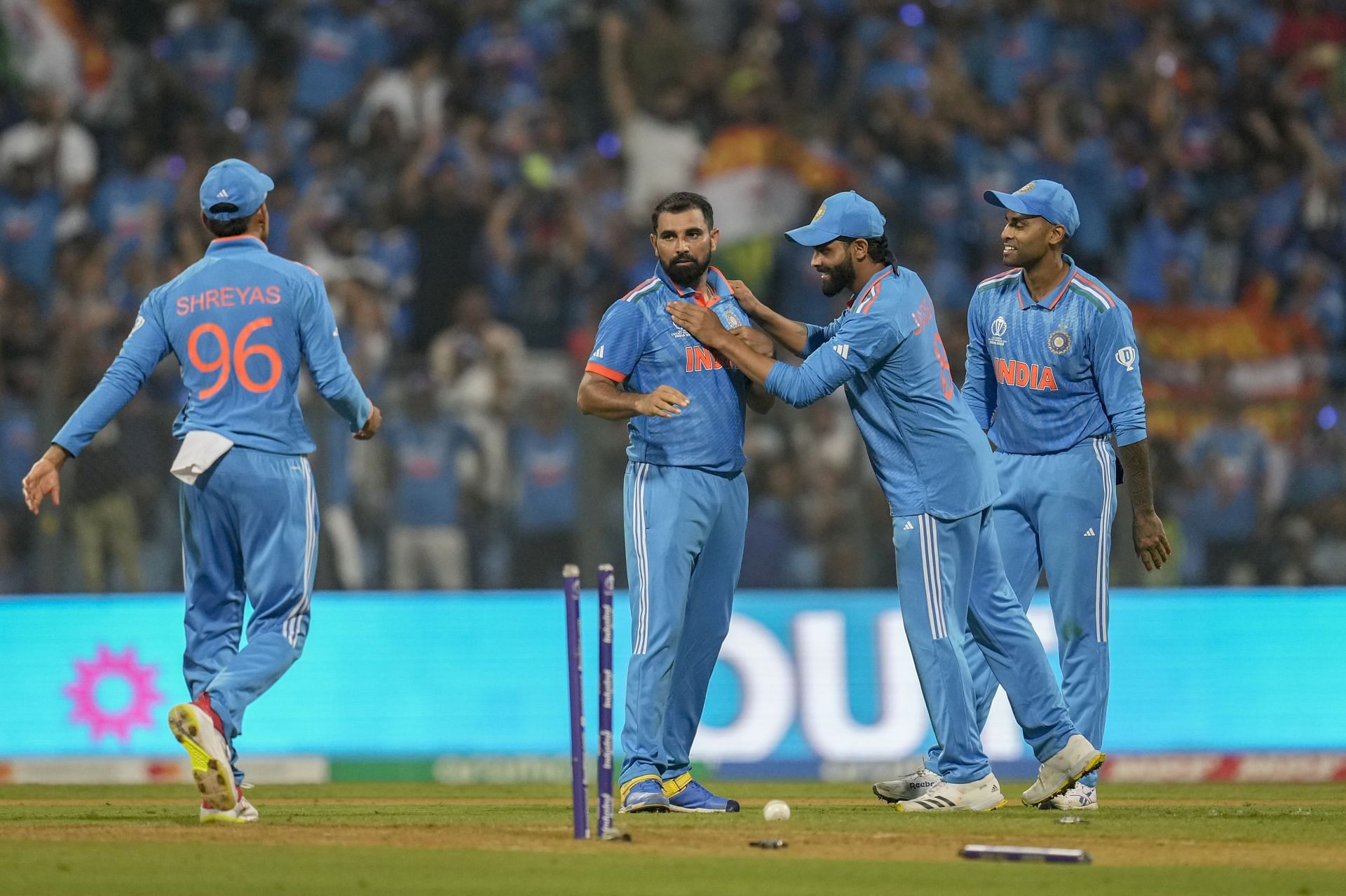 Mohammed Shami celebrating with his teammates. [Getty Images]