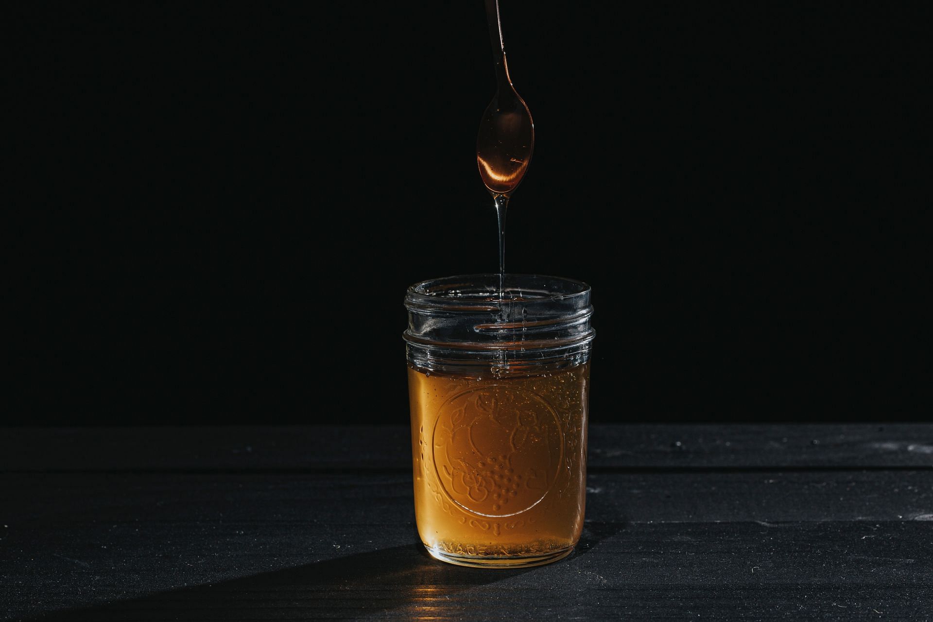 Heating honey (Image via Unsplash/Javier)