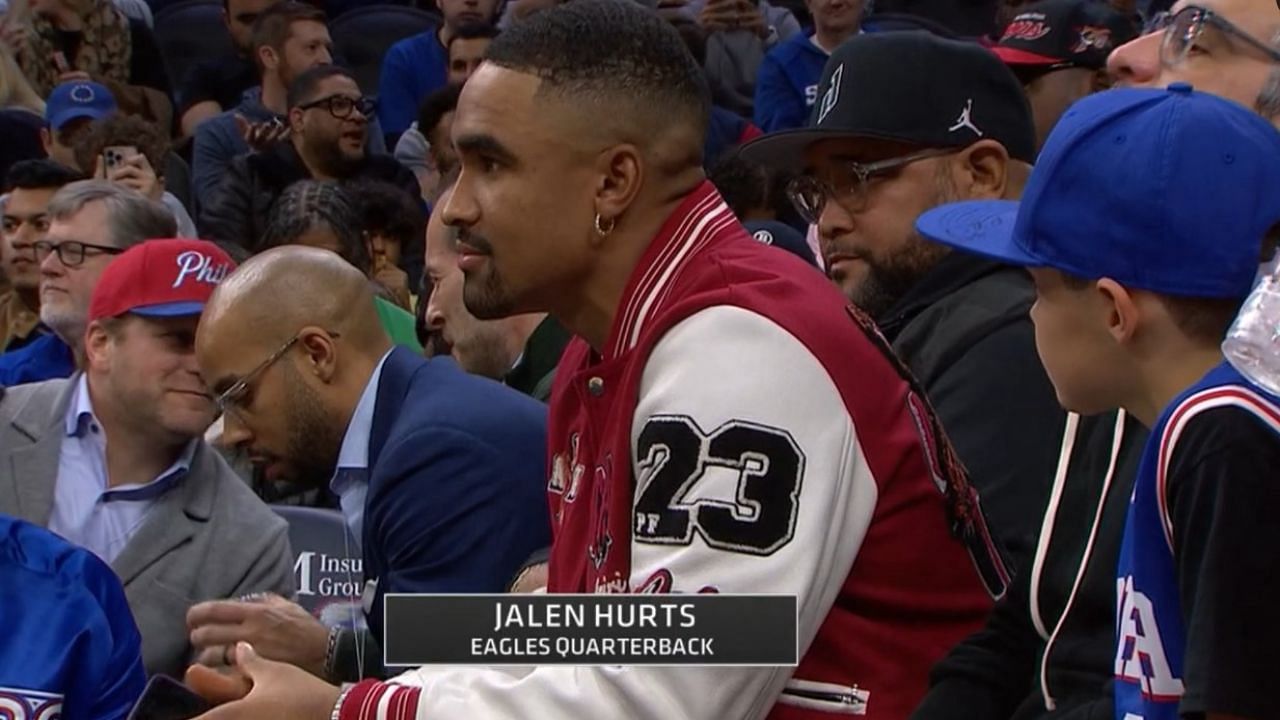 Philadelphia Eagles quarterback Jalen Hurts watches the action between the LA Lakers and the Philadelphia 76ers.