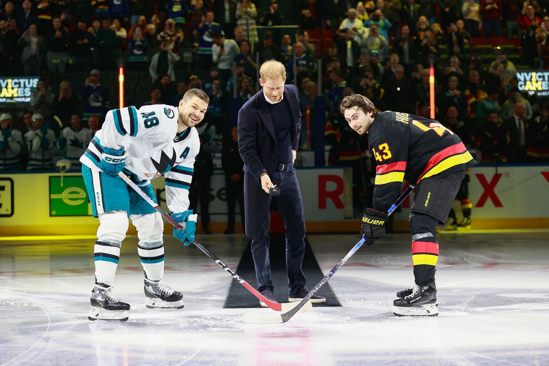 Prince Harry drops the puck in a game between the San Jose Sharks and Vancouver Canucks 