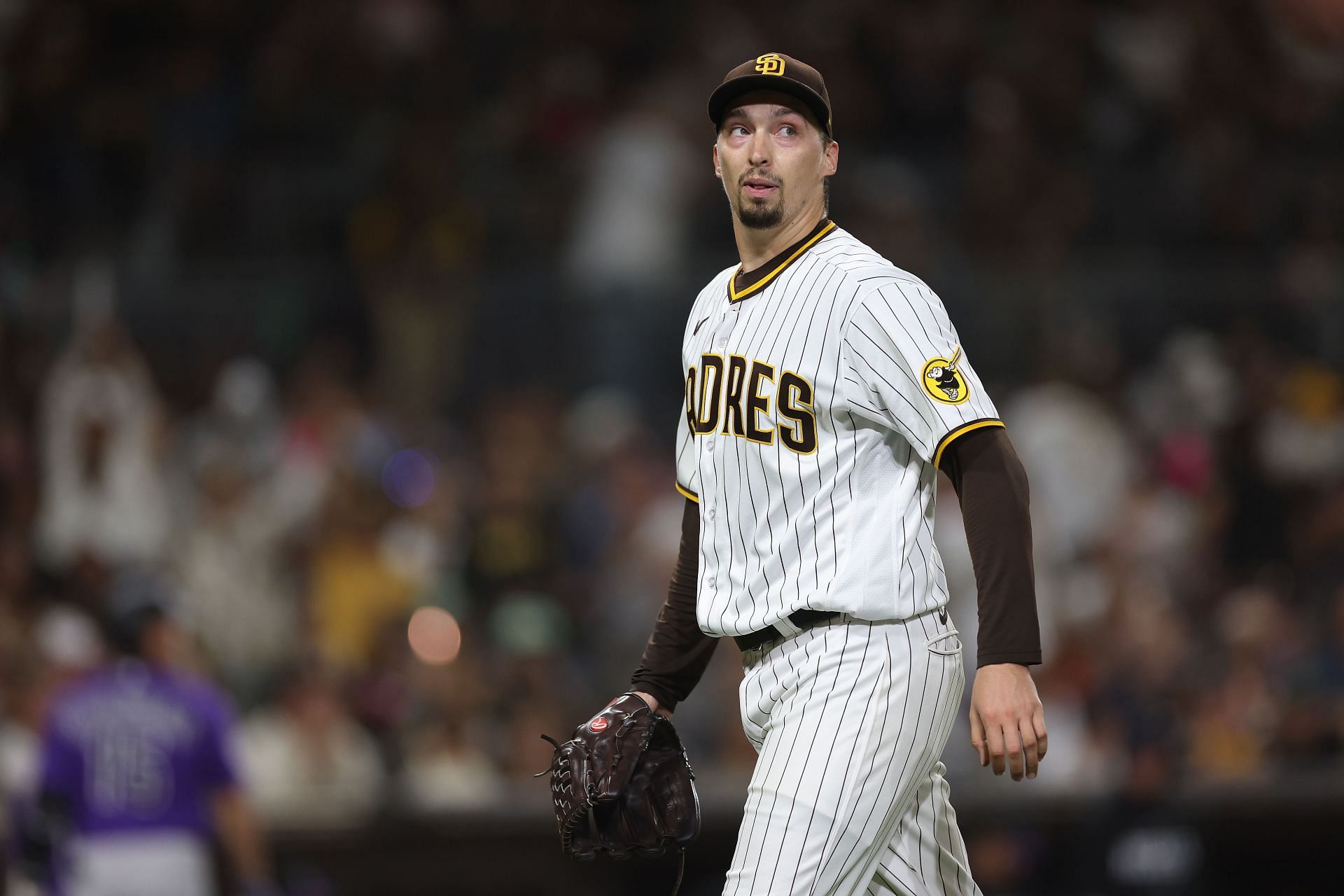 Blake Snell reacts as he walks to the dugout after throwing seven hitless innings