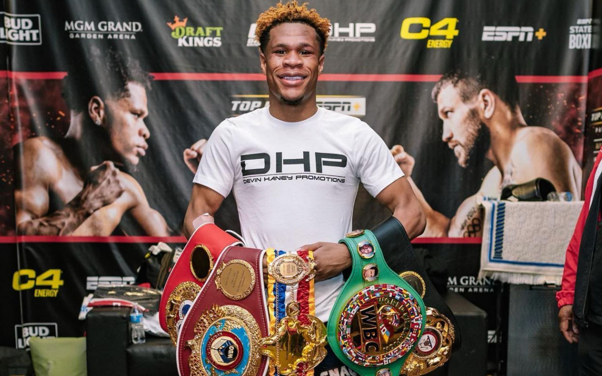 Devin Haney with his four championship belts [Photo Courtesy @realdevinhaney on Instagram]