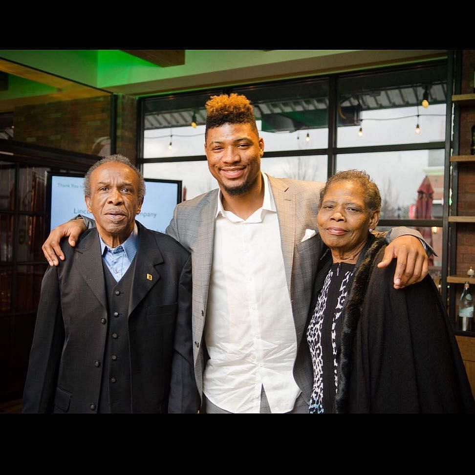 Marcus Smart with his parents (Source: Instagram @youngamechanger)