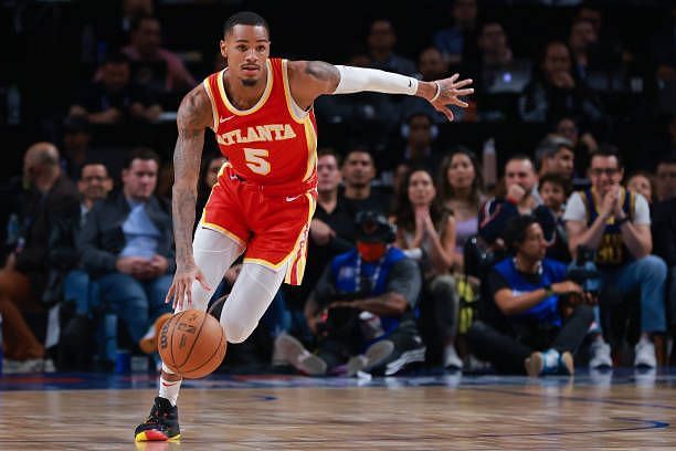 Where did Dejounte Murray play college basketball?