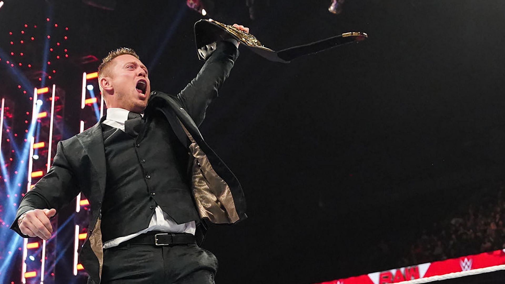 The Miz raises the WWE Intercontinental Championship in the air