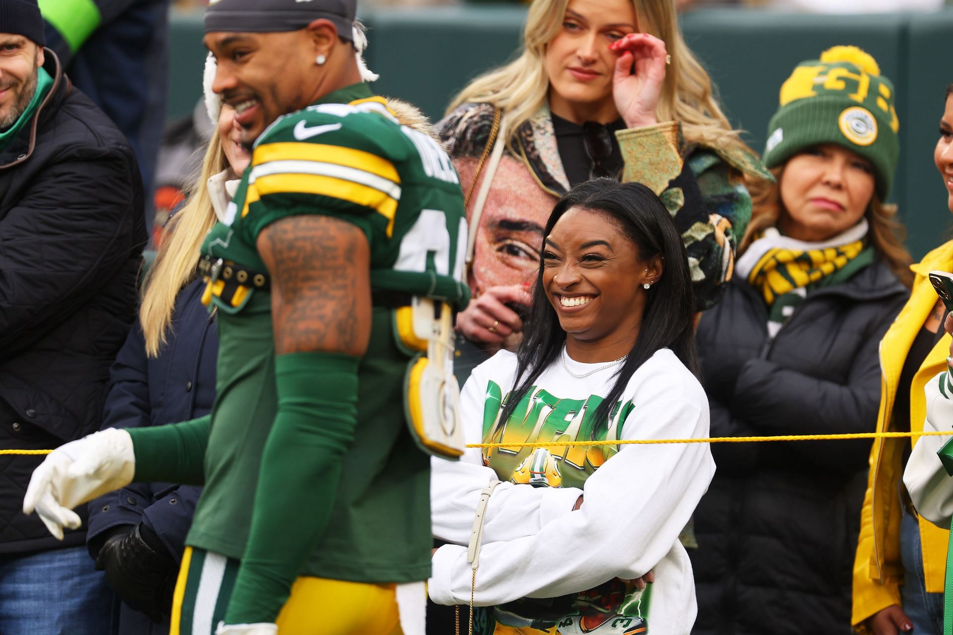 Simone Biles looks at her husband Jonathan Owens before a game between the Minnesota Vikings and the Green Bay Packers at Lambeau Field in Green Bay, Wisconsin.