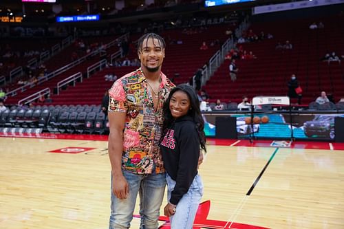 Simone Biles and Jonathan Owens attend a game between the Houston Rockets and the Los Angeles Lakers at Toyota Center