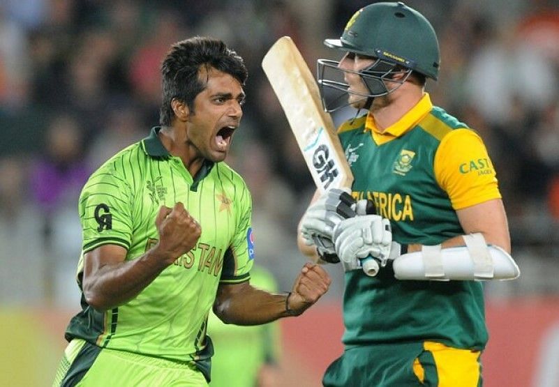 Rahat Ali (left) of Pakistan celebrates picking up the wicket of David Miller (right).