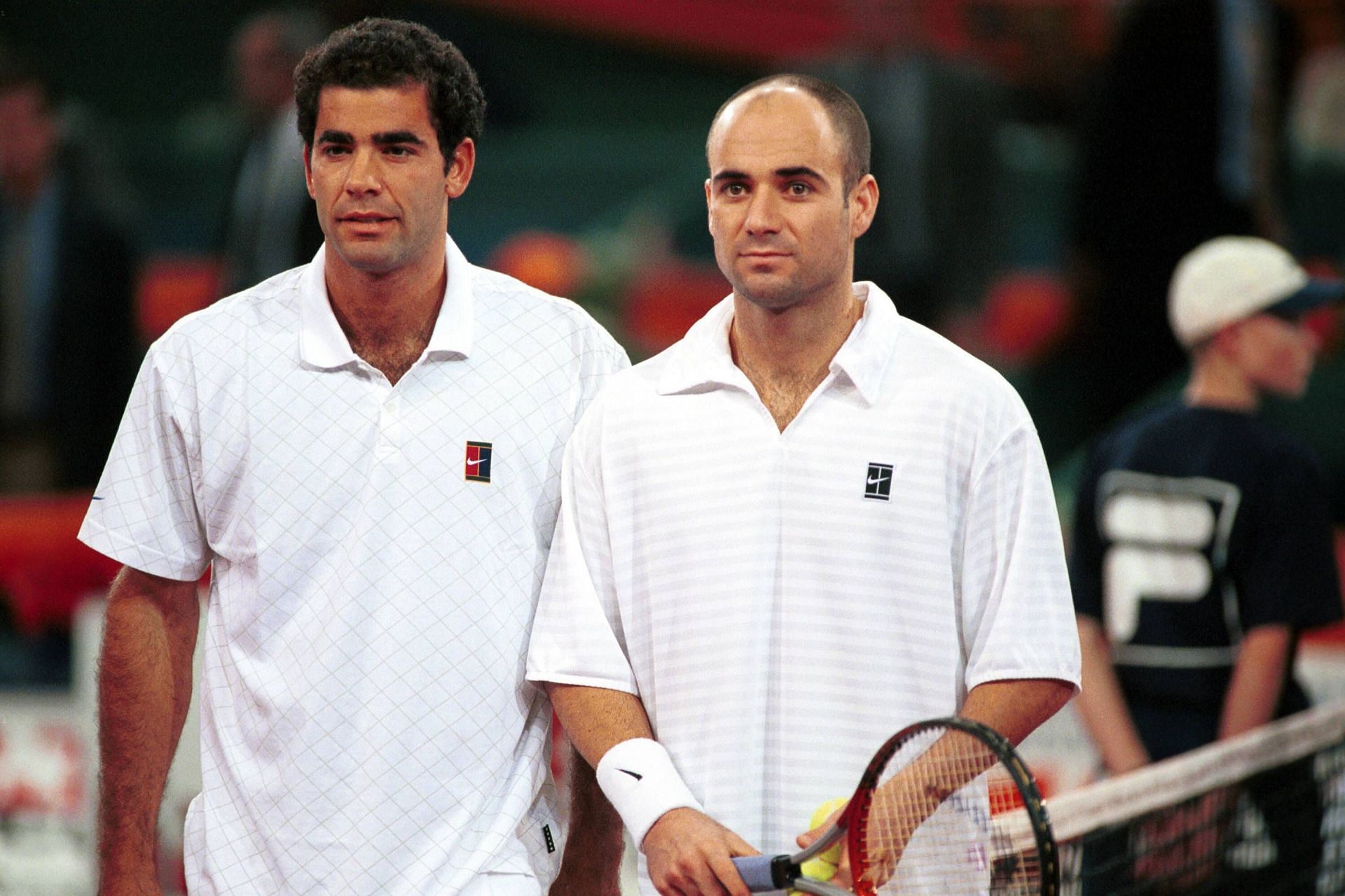 Pete Sampras (L) and Andre Agassi pose for a photo