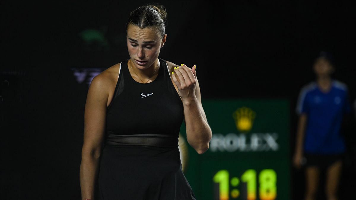 Aryna Sabalenka reacts during her group-stage battle against Elena Rybakina