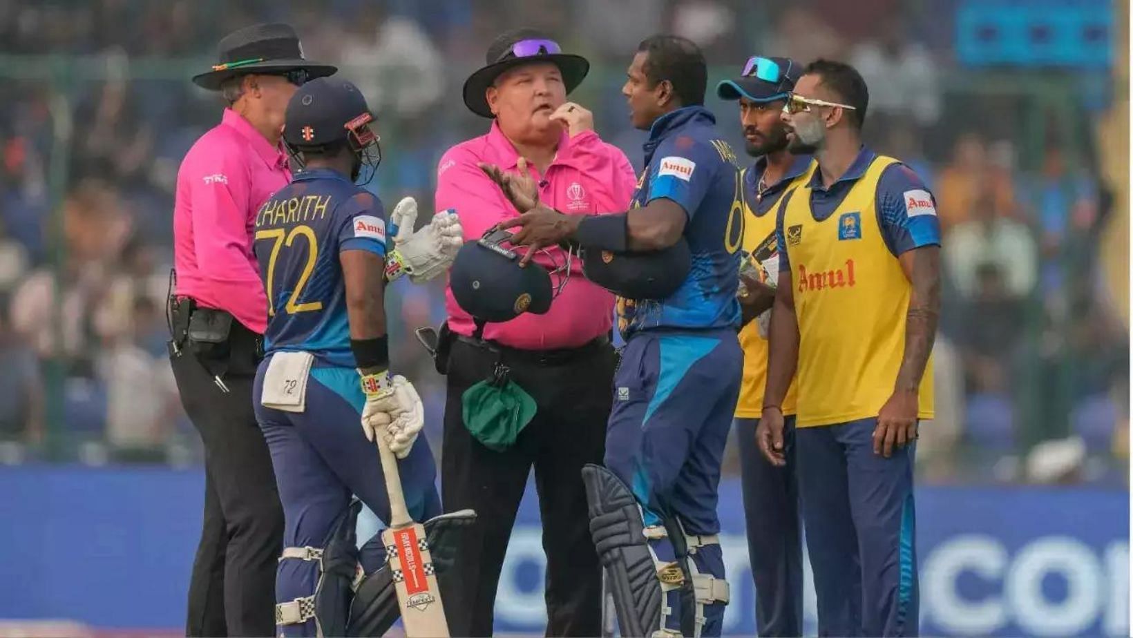 Angelo Mathews in discussion with the on-field umpires.