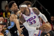 Robert Covington of the Philadelphia 76ers (right)