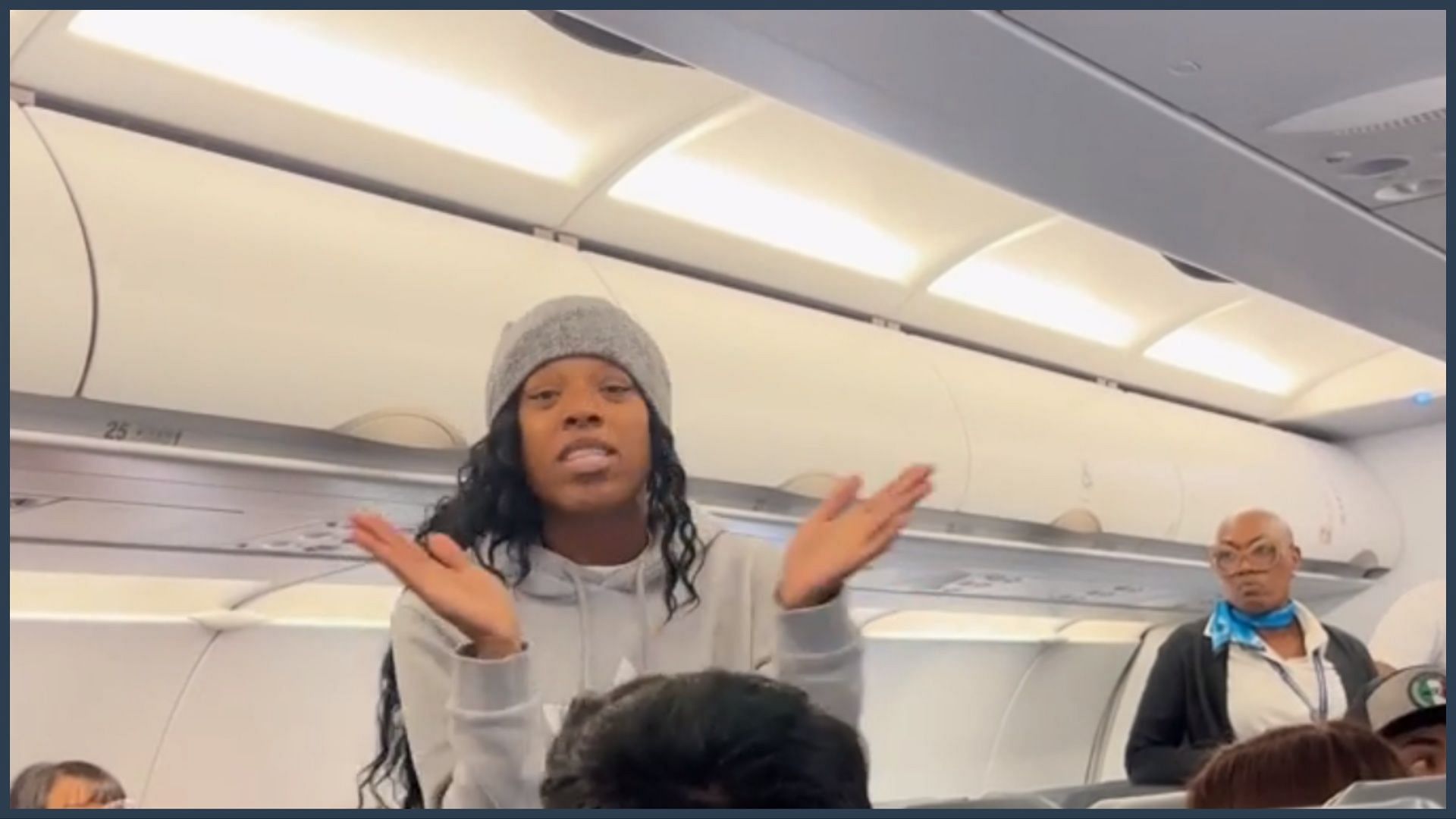 The woman in the grey beanie later began singing hymns on Frontier Airlines (Image via Reddit/r/PublicFreakout)