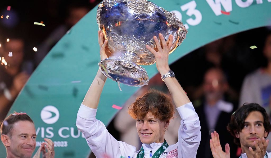 Jannik Sinner poses with the 2023 Davis Cup trophy