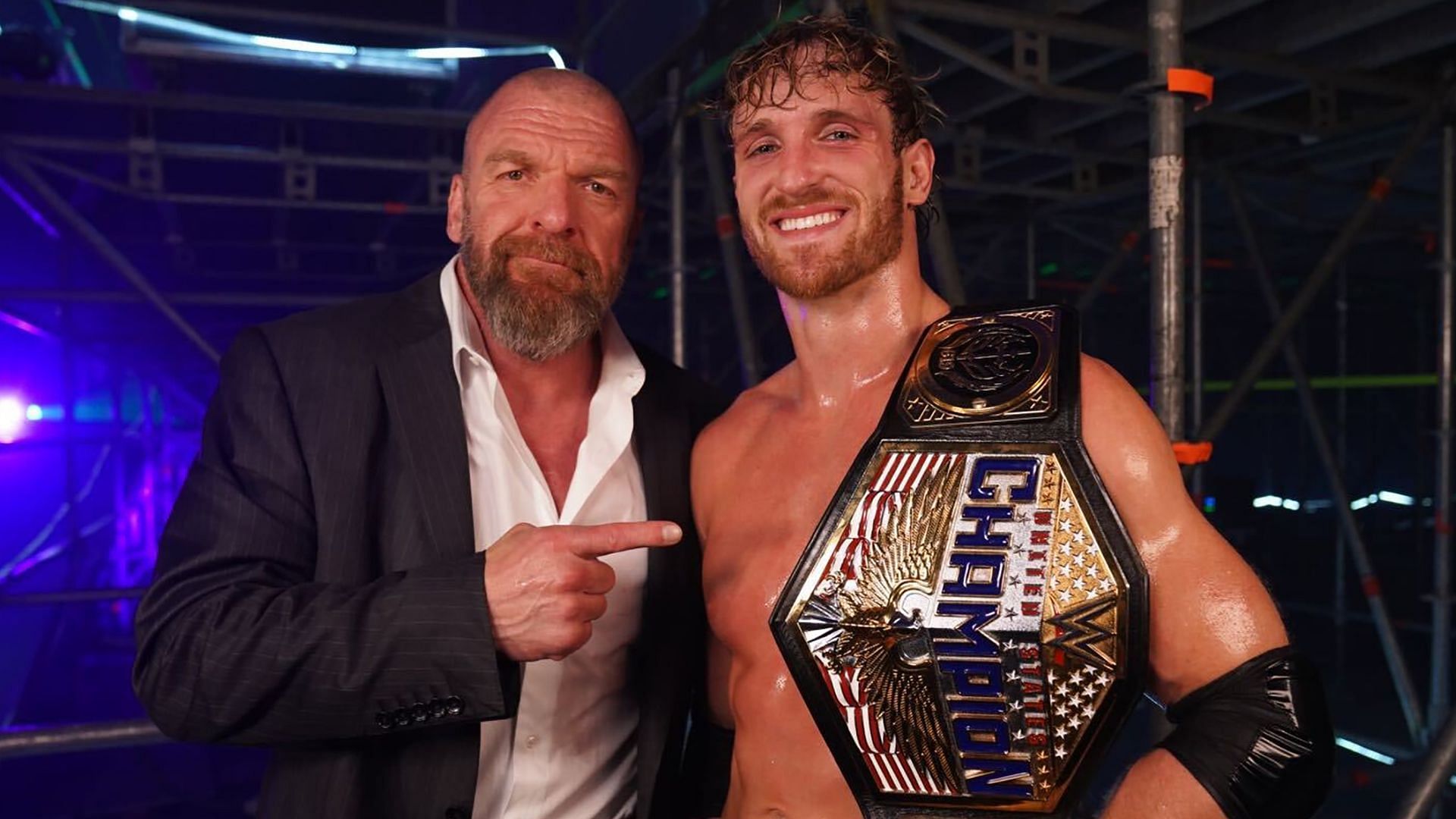 Triple H poses with WWE United States Champion Logan Paul
