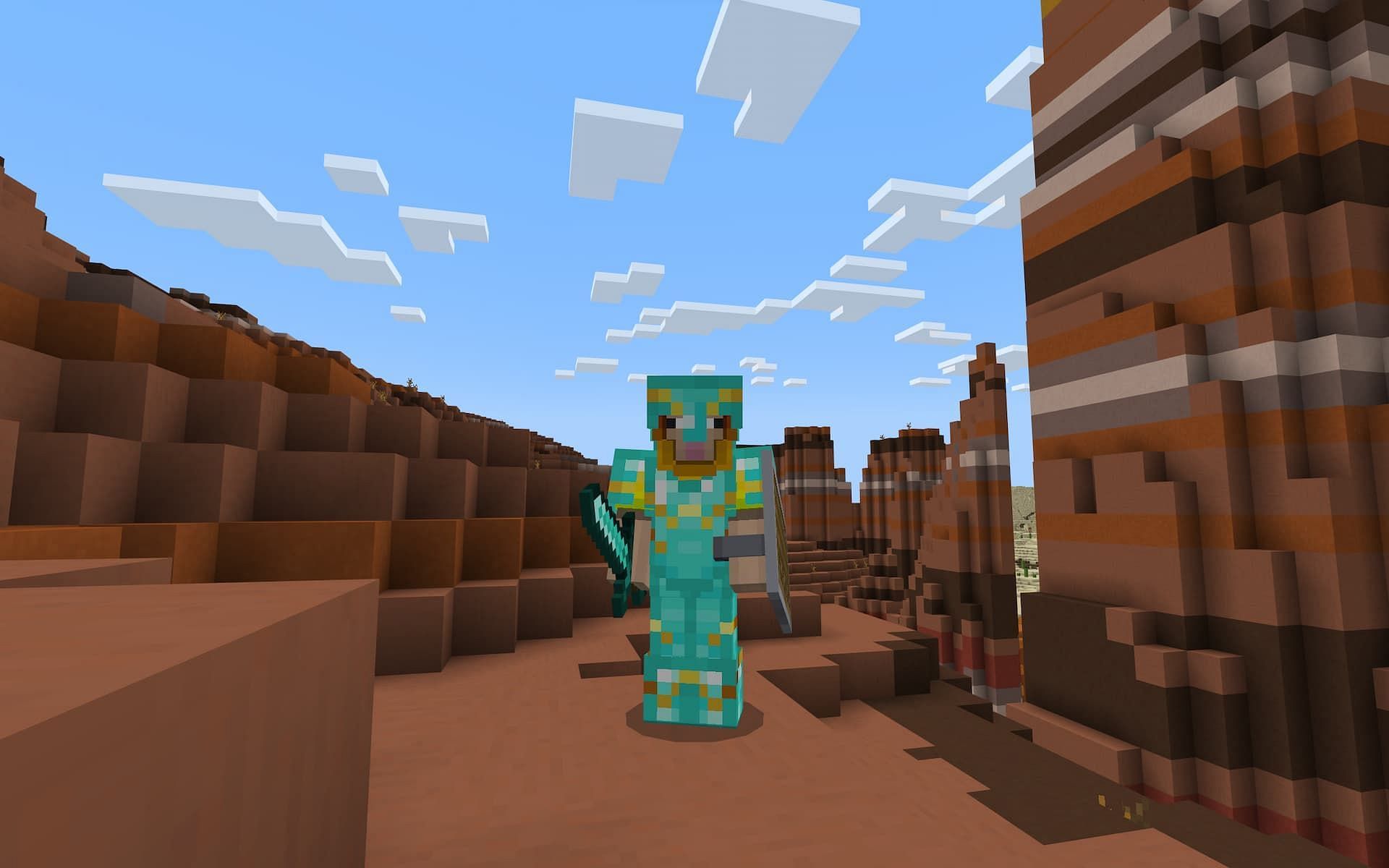 A player stands in a desert biome with a full set of Diamond armor with the Raiser armor trim.