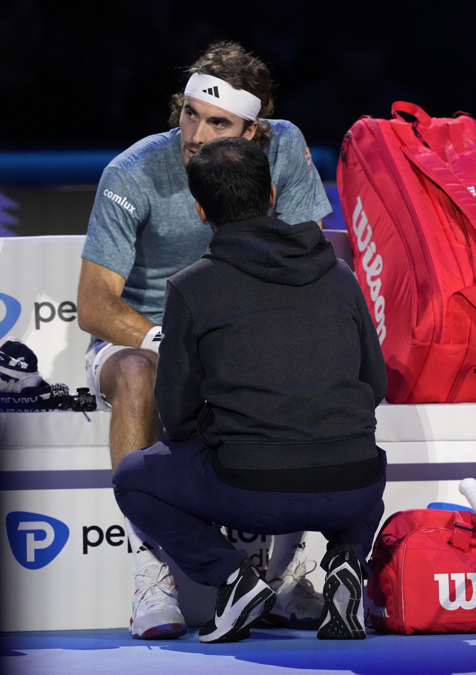 Stefanos Tsitsipas being attended to during his match against Holger Rune