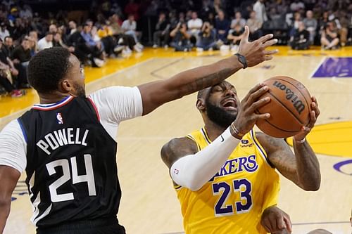 Norman Powell of the LA Clippers and LeBron James of the LA Lakers