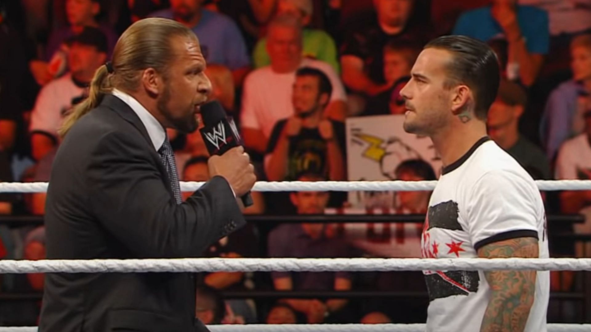 Triple H (left) and CM Punk (right)