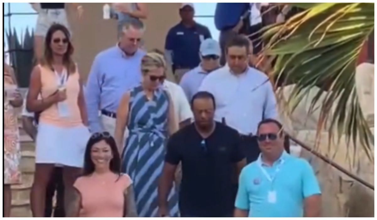 Tiger Woods walking down the stairs