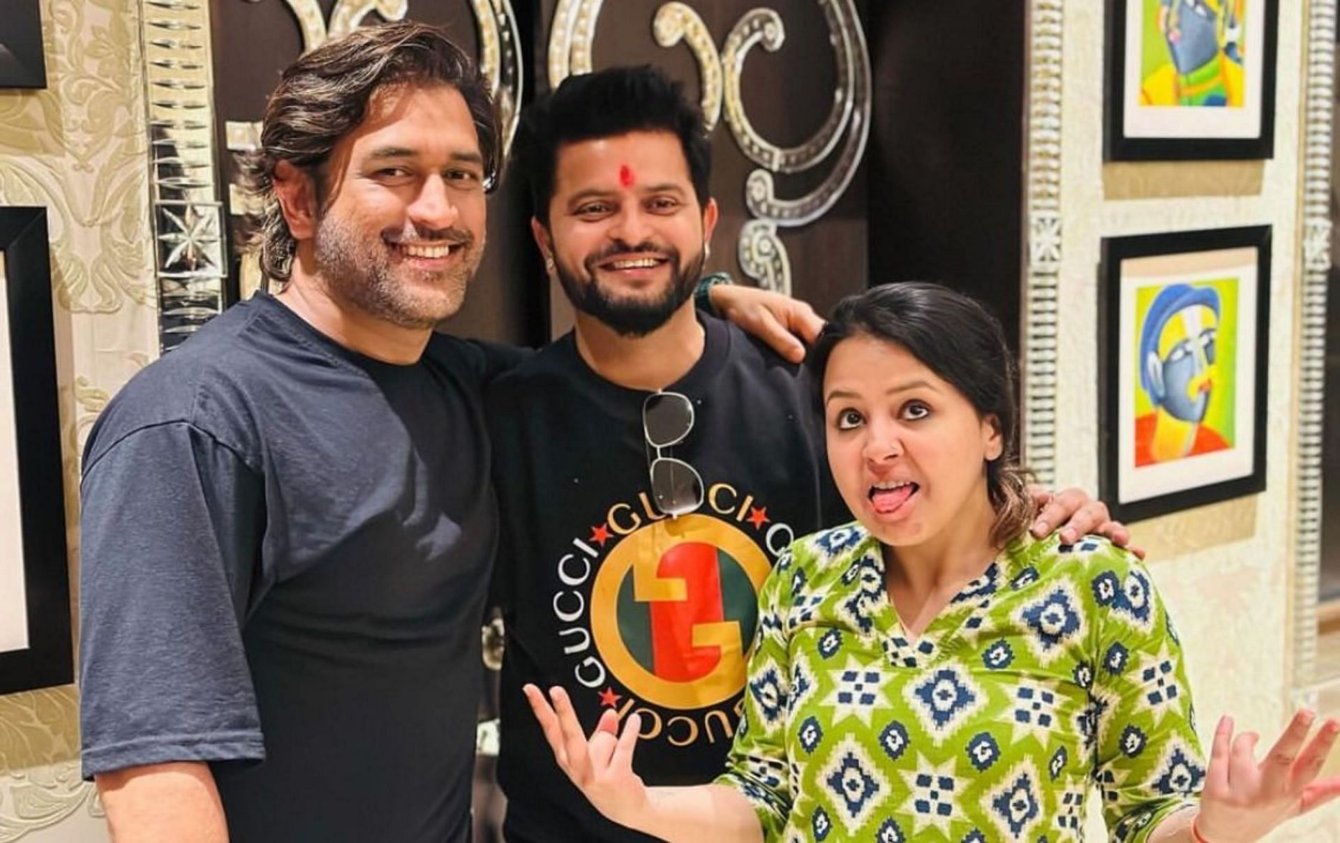 Suresh Raina with MS Dhoni and his wife. 