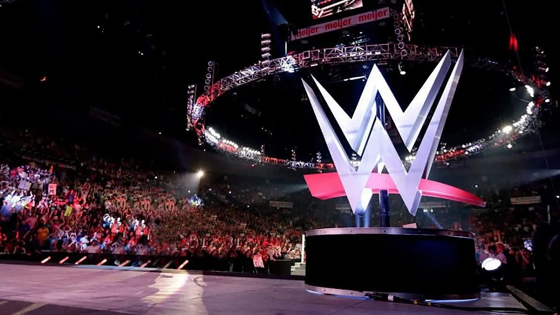 The WWE logo and stage set on display in arena